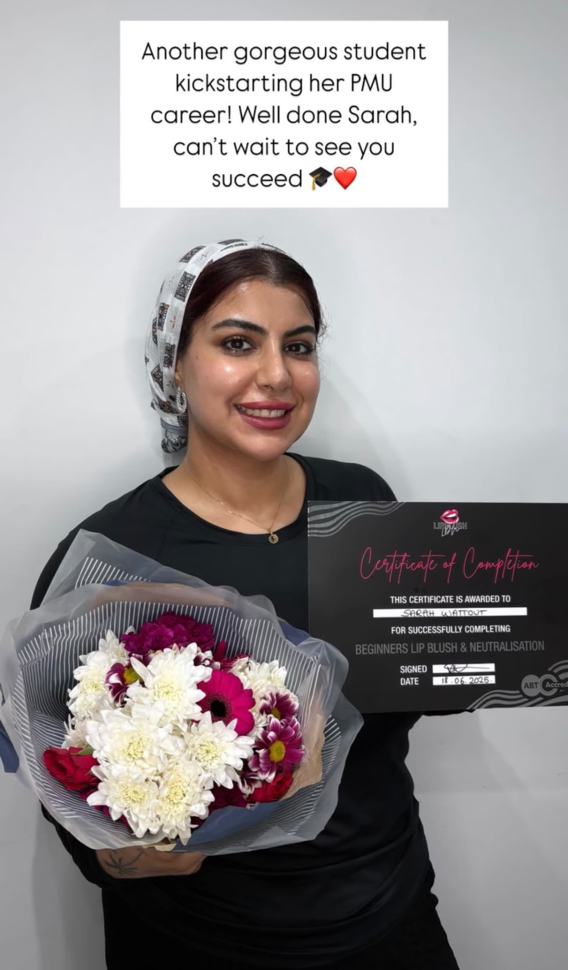 Student with her certificate and bouquet